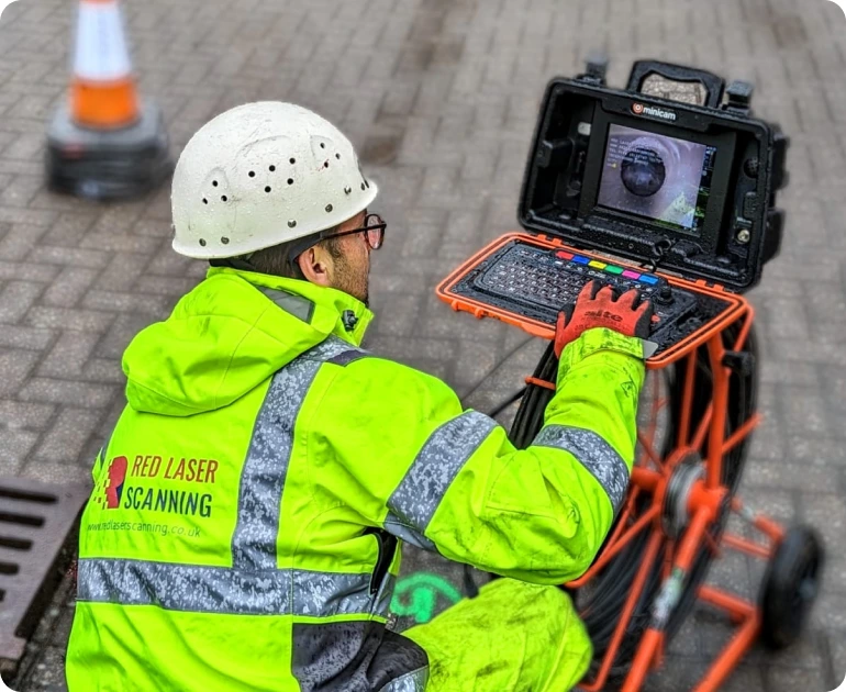 CCTV surveyor reviewing live footage of a drainage inspection, ensuring accurate detection of issues and effective solution planning