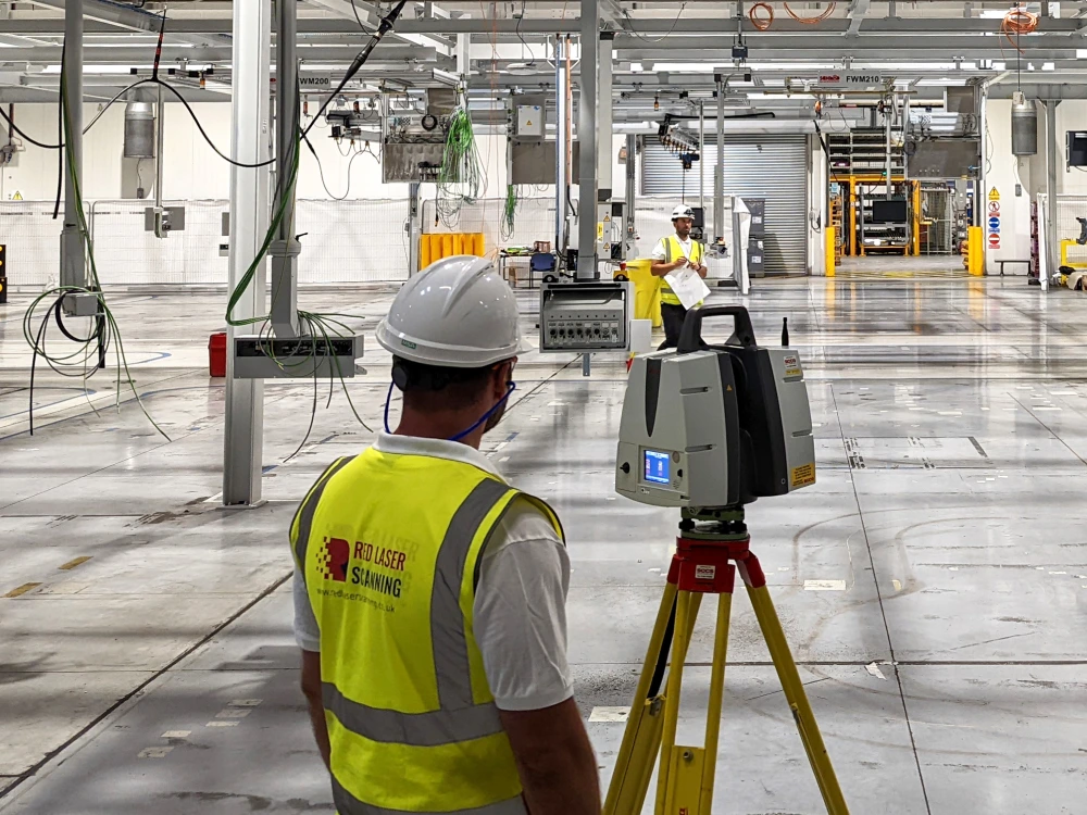 Experts performing detailed mapping and comprehensive floor flatness surveys in a factory for precision and reliability