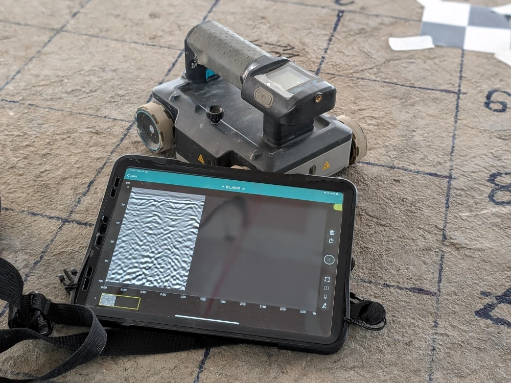 Ground Penetrating Radar (GPR) equipment used for concrete scanning, detecting subsurface features like rebar and voids