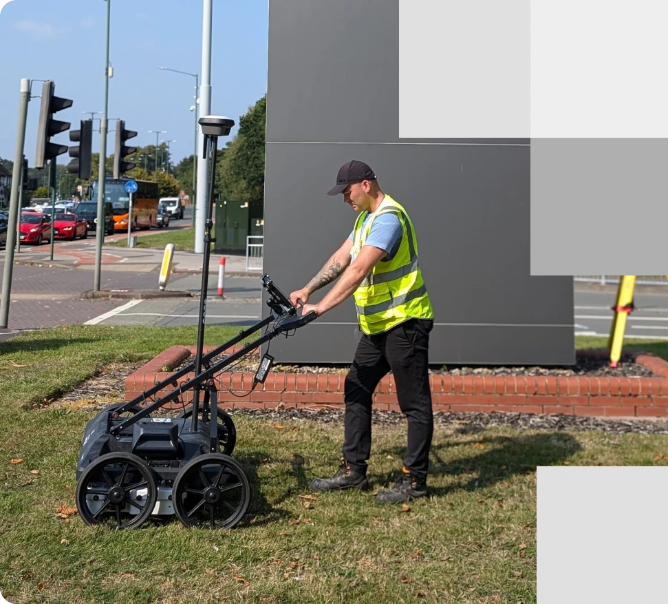 A utility surveyor using GPR equipment conducting an underground survey to detect utilities