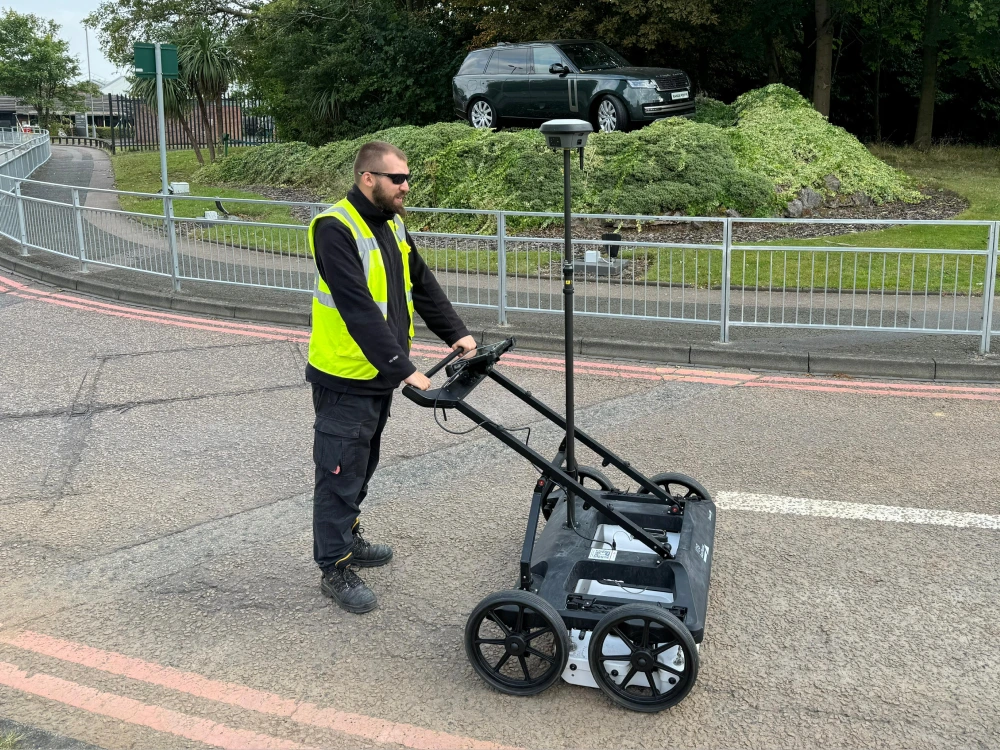 Expert at Red Laser performing a PAS 128 survey using advanced technology to accurately locate and map underground utilities