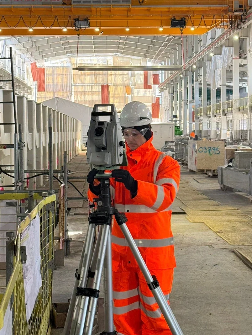 A surveying and setting out expert using 3D laser scanning and a total station to accurately survey infrastructure with precision