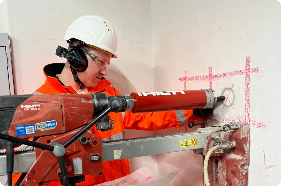 Red Laser expert performing core drilling service with precision on interior wall