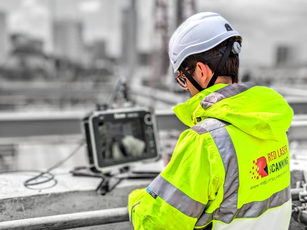 Surveyor conducting a concrete scan with GPR equipment on a construction site