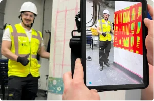 Technician reviewing GPR concrete scanning results on tablet showing reinforcement grid