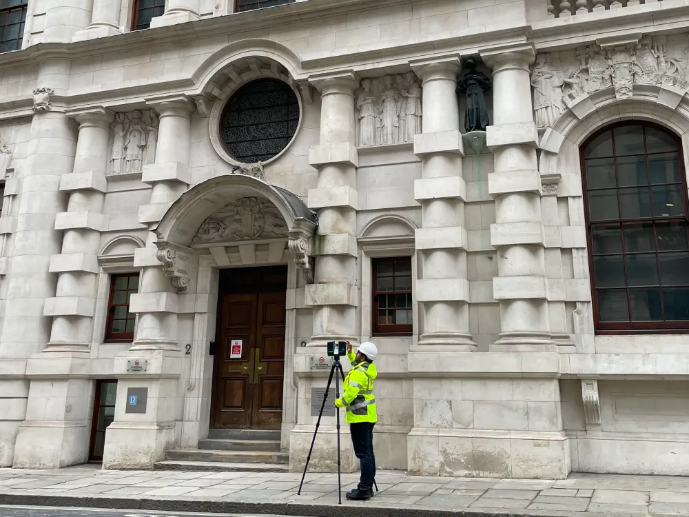 Surveyor carrying out a measured survey of a heritage building using a 3D laser scanner