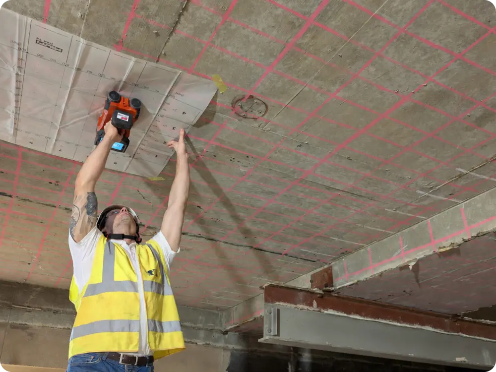 Surveyor carrying out concrete scanning using GPR and Ferroscan technology at Royal Free Hospital